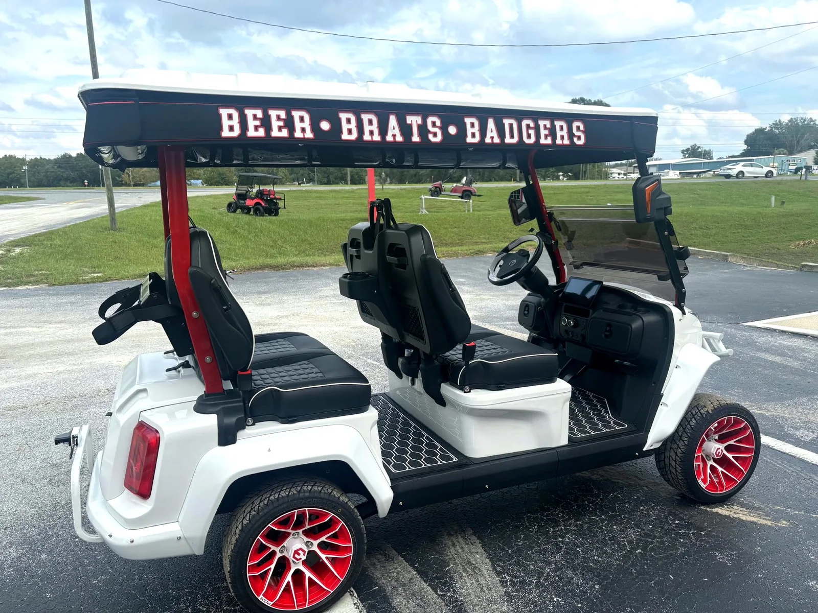 Fully custom Wisconsin Badgers canvas top with lettered valances on a white lifted cart