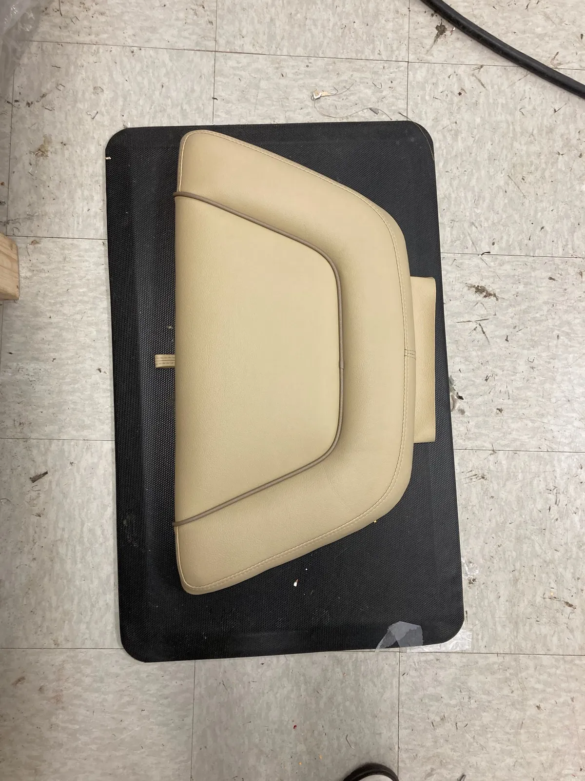 Tan marine vinyl seat back panel with contour piping
