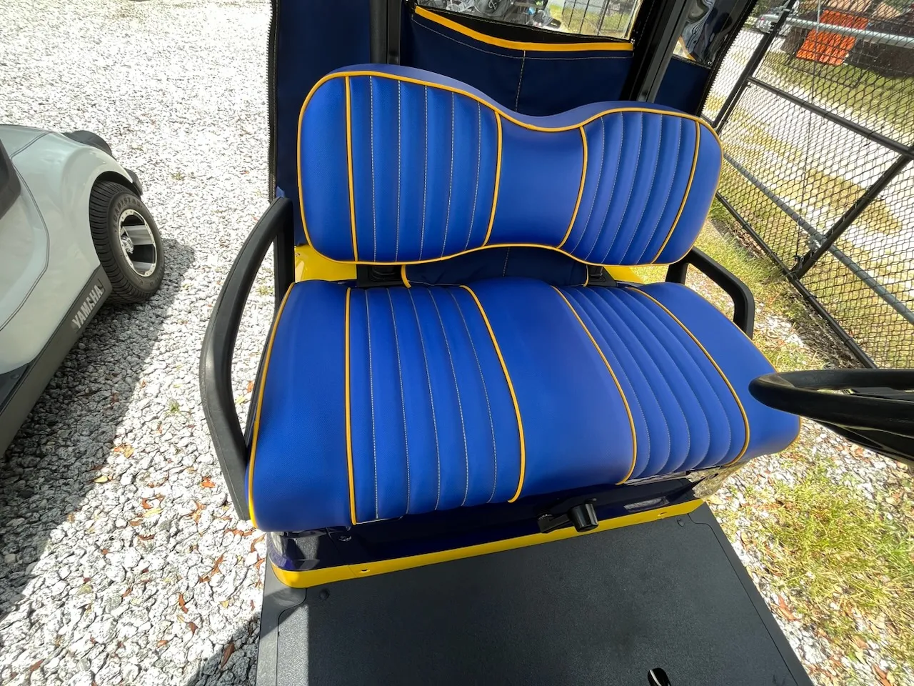Royal blue pleated golf cart seat with yellow piping