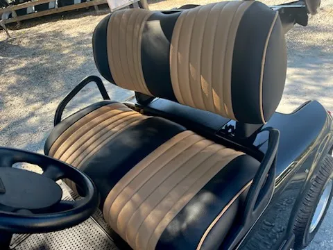 Black and tan pleated golf cart seats with piping