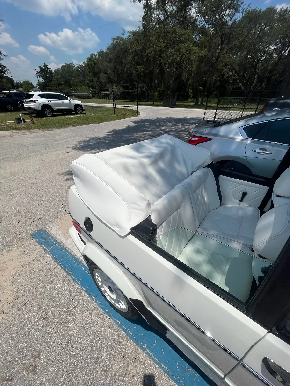 White convertible boot cover with diamond-stitched leather interior