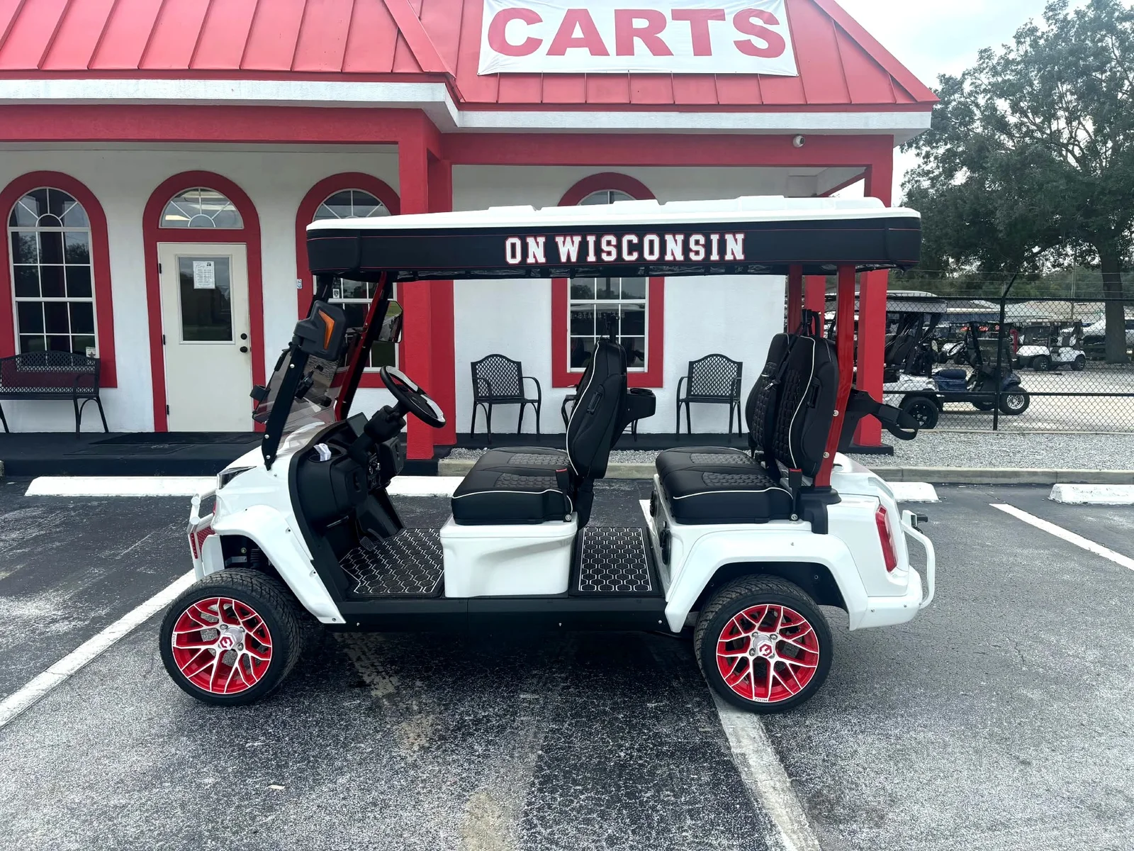 Fully custom Wisconsin Badgers canvas top with lettered valances on a white lifted cart
