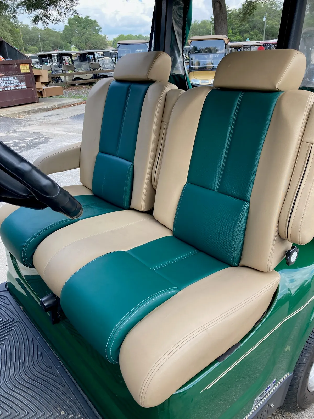 Green and tan captain bucket seats with headrests