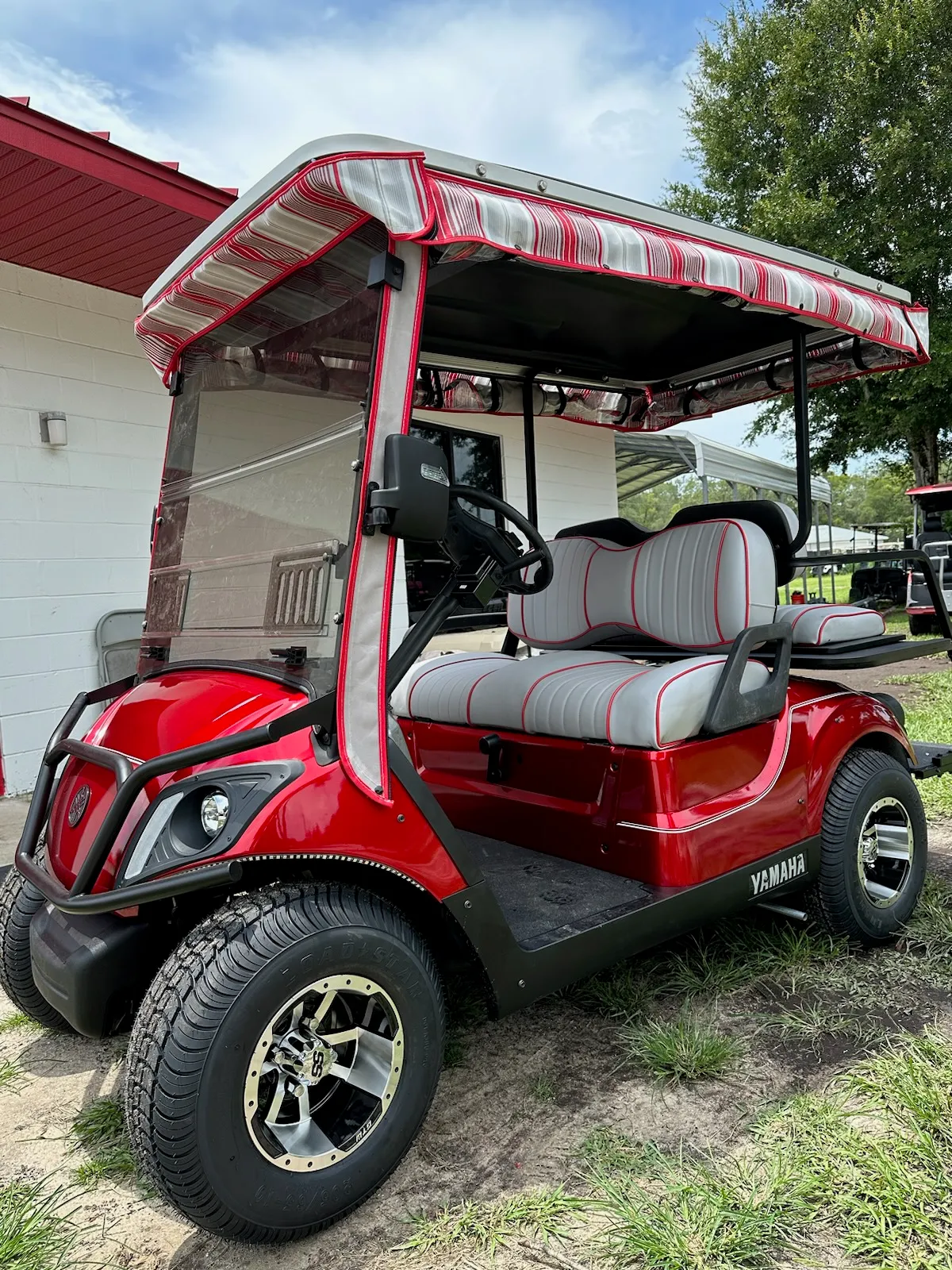 Red striped awning canopy on Yamaha with piped seats