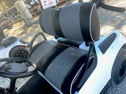 Black and gray pleated golf cart seats with white piping