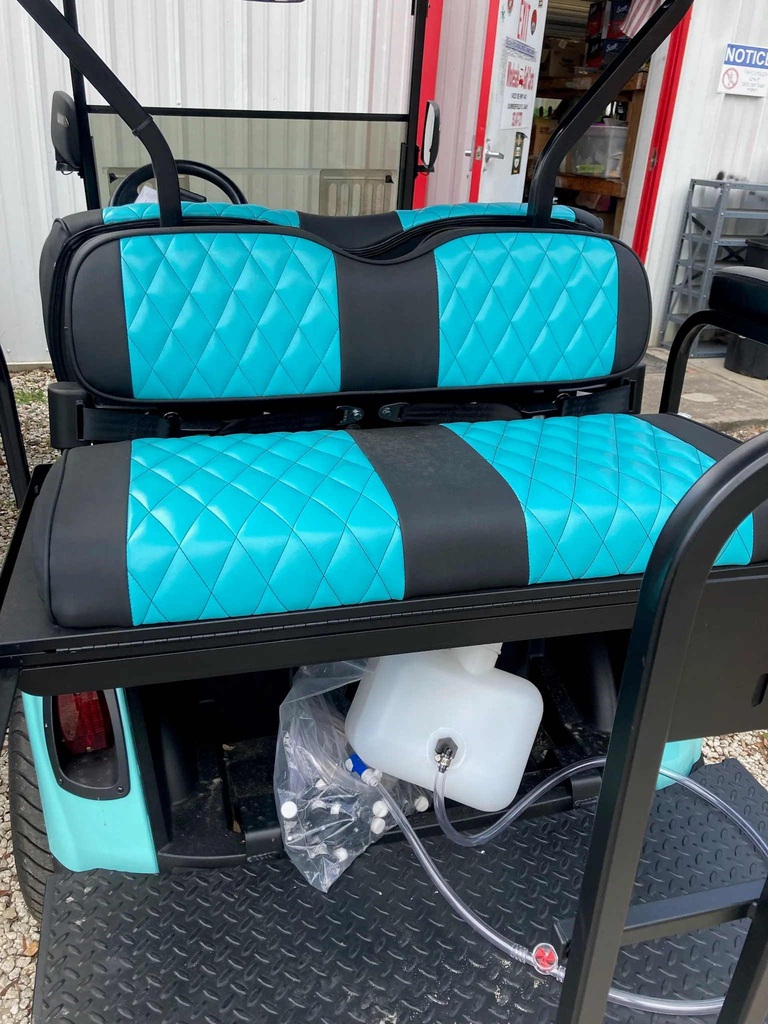 Teal and black diamond-stitched golf cart bench seats