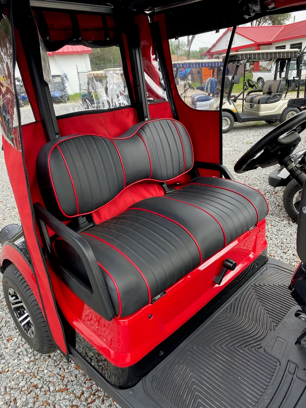 Black golf cart seats with red piping and trim