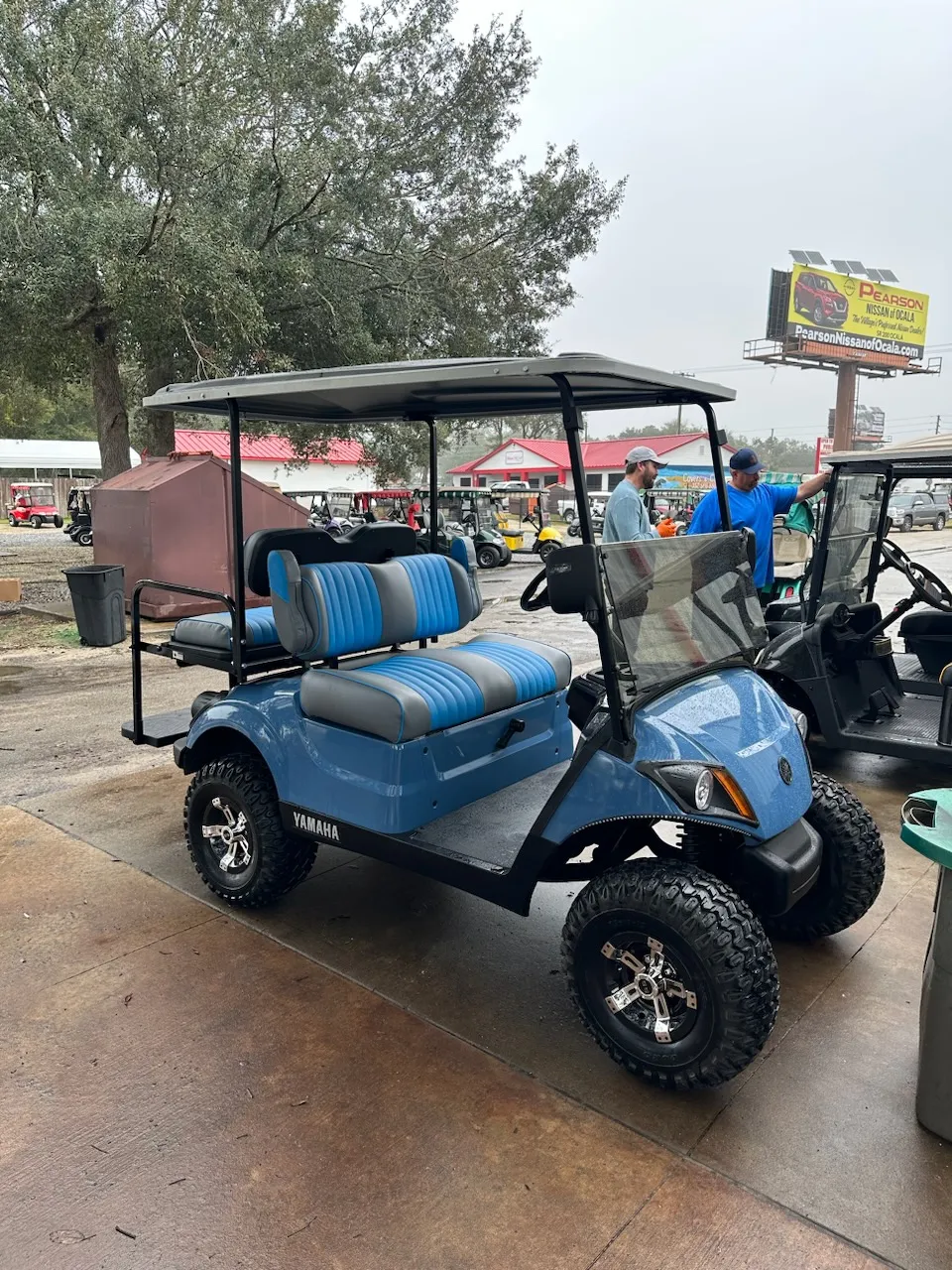 Lifted blue Yamaha cart with blue-gray pleated seats