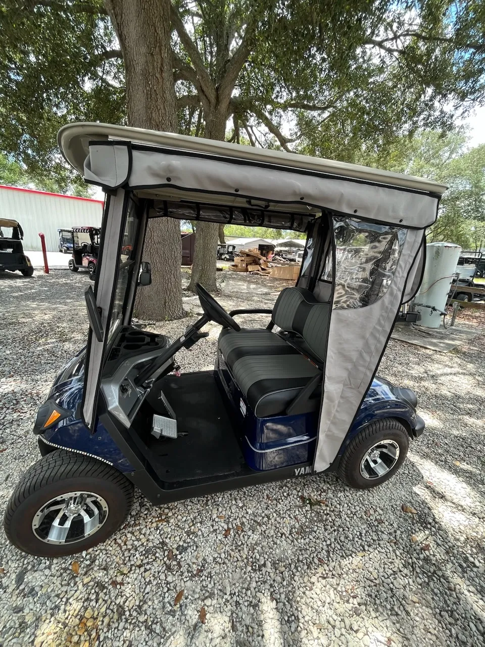 Navy Yamaha cart with tan track-style enclosure